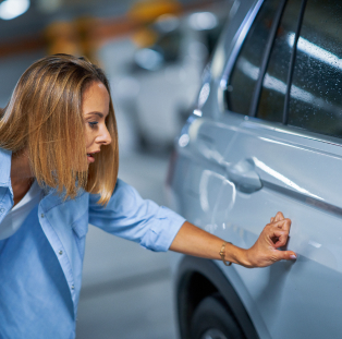 Looking at a dent on a car