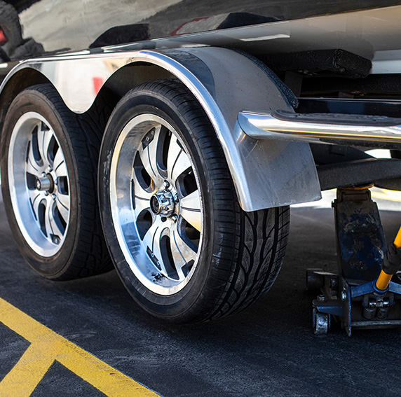 Close up of a trailer tire and wheel repair