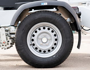 Close up of a trailer tire and wheel